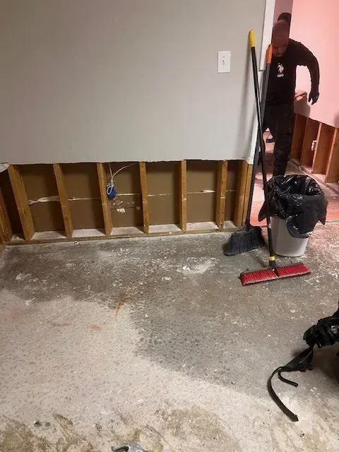 Atlanta plumber fixing a running toilet inside a residential bathroom