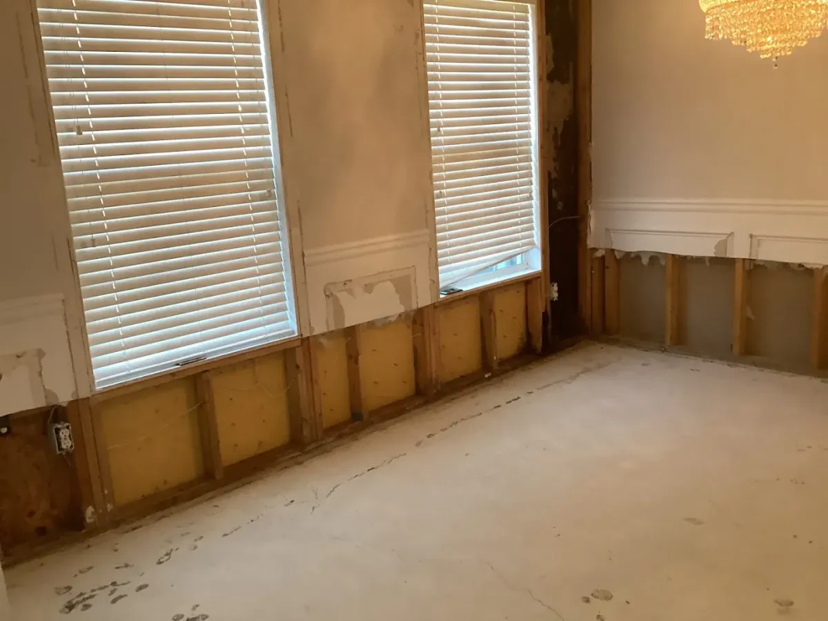 Plumber repairing water pressure regulator in Atlanta home